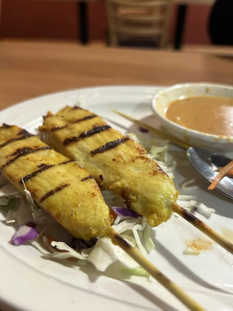 Chicken Satay Served with Peanut Sauce and Cucumber Salad