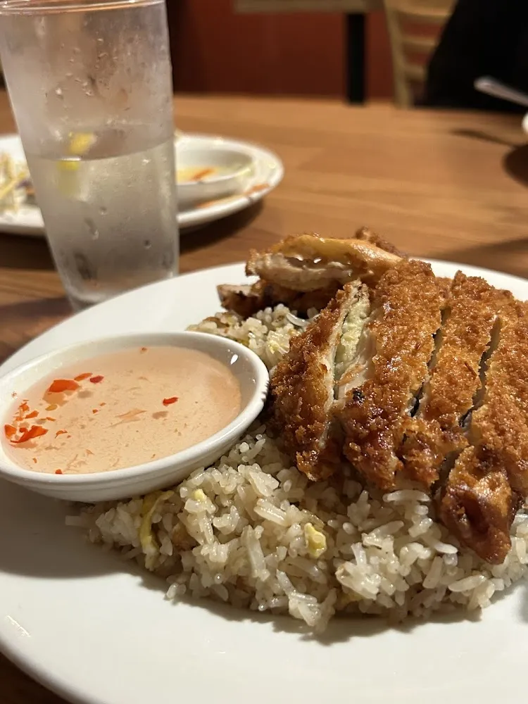Crispy Chicken over Fried Rice Served